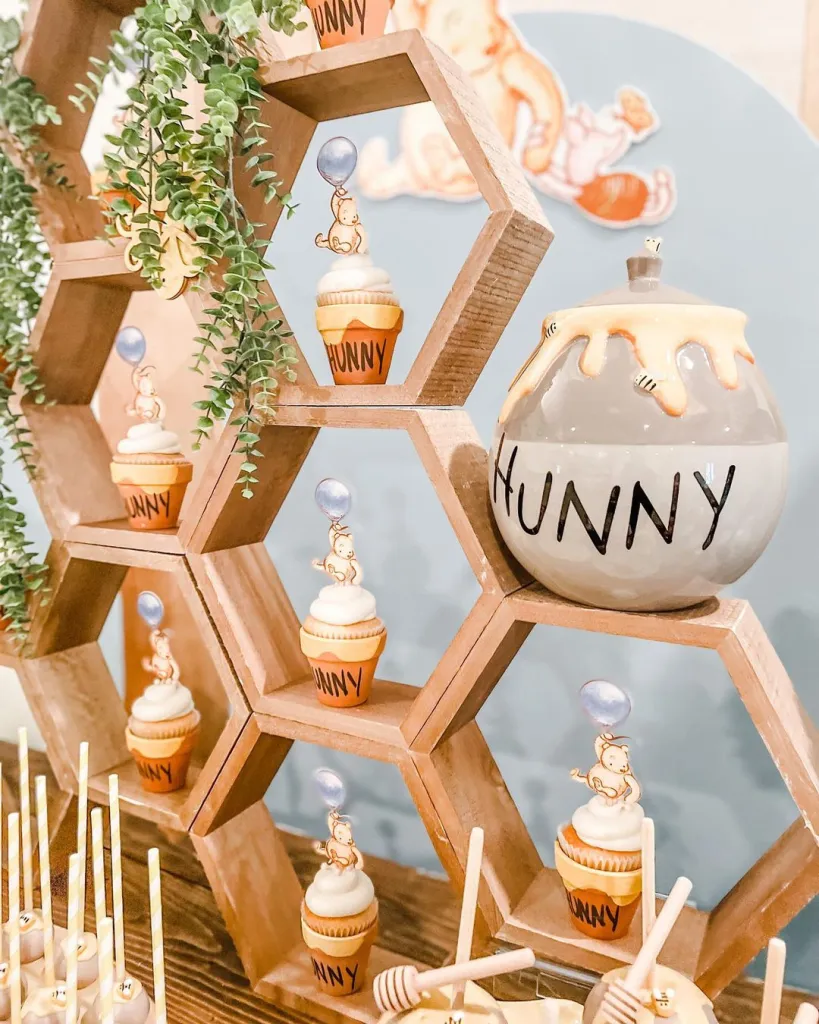 Beautiful honeycomb cupcake stand with teddy bear cupcakes and honey stirrers - great dessert table centerpiece for Winnie the Pooh baby showers or Bee baby shower.