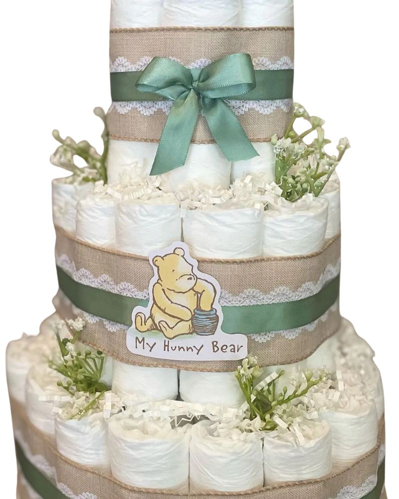 Beautiful Winnie the Pooh diaper cake with Pooh bear cutouts, burlap ribbon, raffia and lace. Perfect for a Winnie the Pooh baby shower centerpiece or a unique baby shower gift